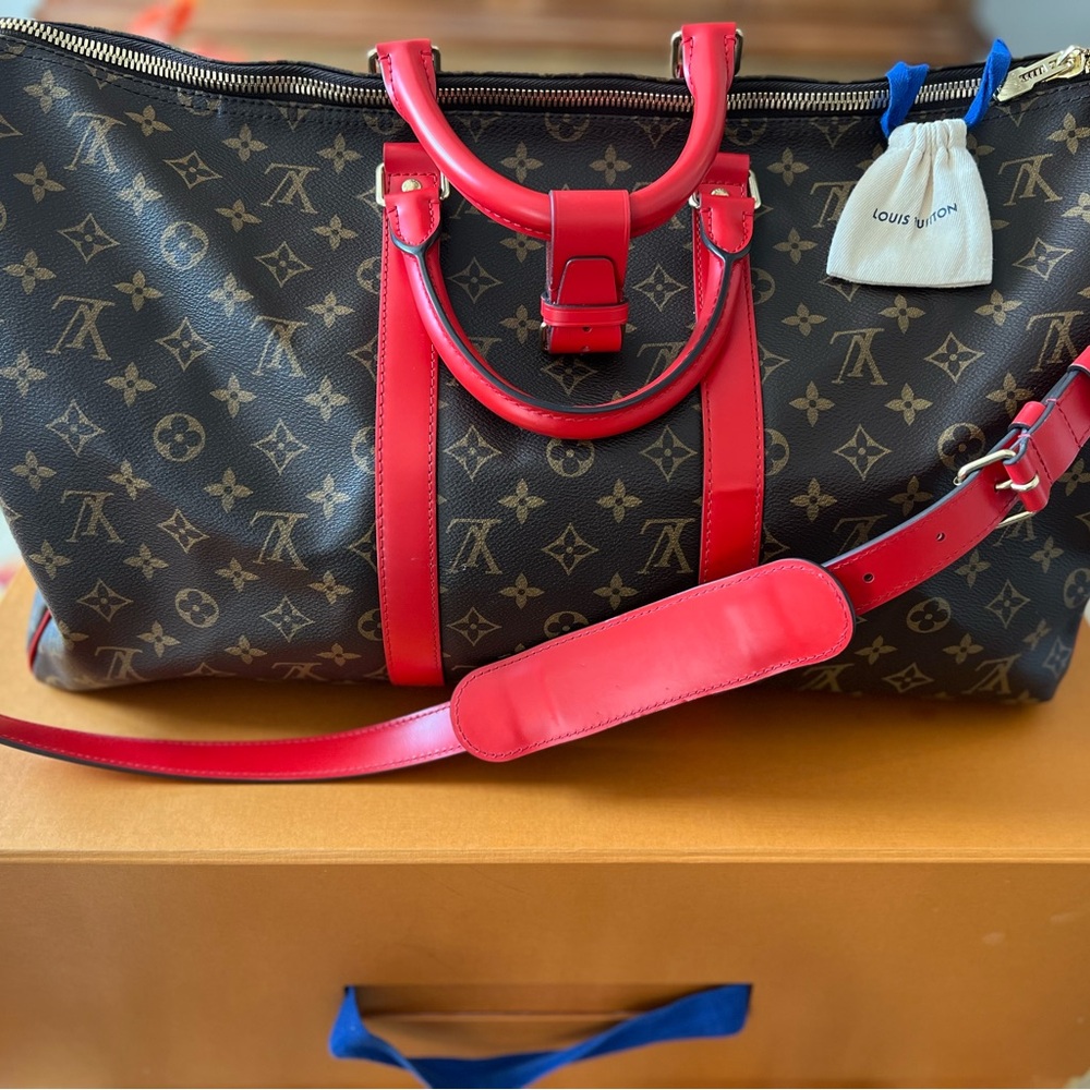 Louis Vuitton Keepall Bandouliere 50 with red trim